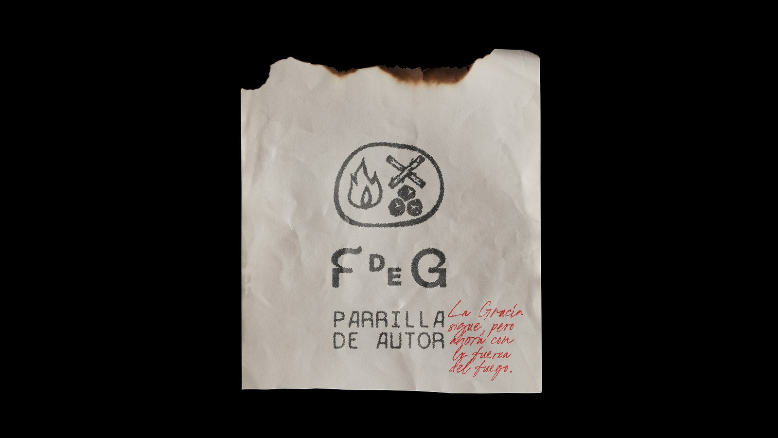 Fuego de Gracia — bolsa de papel con bordes quemados
